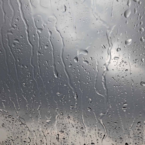 Raindrops on a dark window