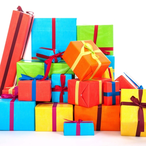 A pile of bright, colorful wrapped presents
