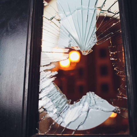 Broken glass black door of a store