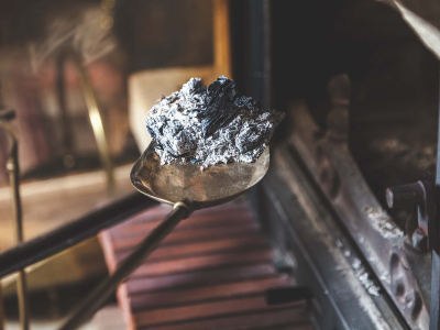 Cleaning ash out of a fireplace