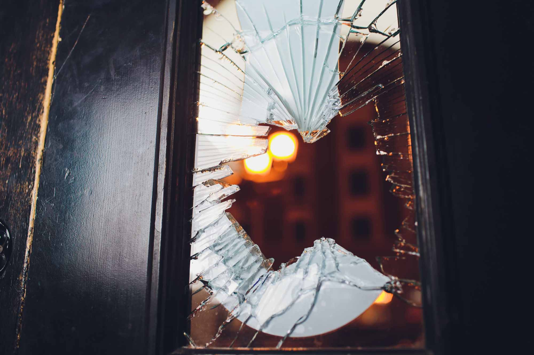 Broken glass black door of a store