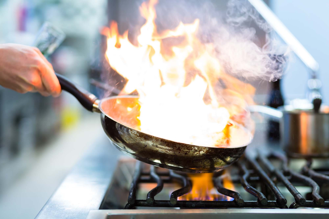A flambé in a professional kitchen